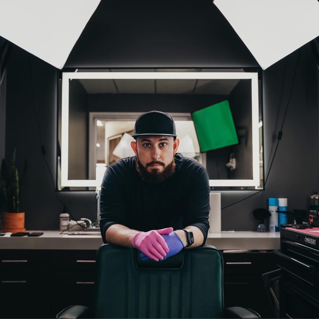 Justin Smith — SmittyBlendz, leaning on his chair in the studio