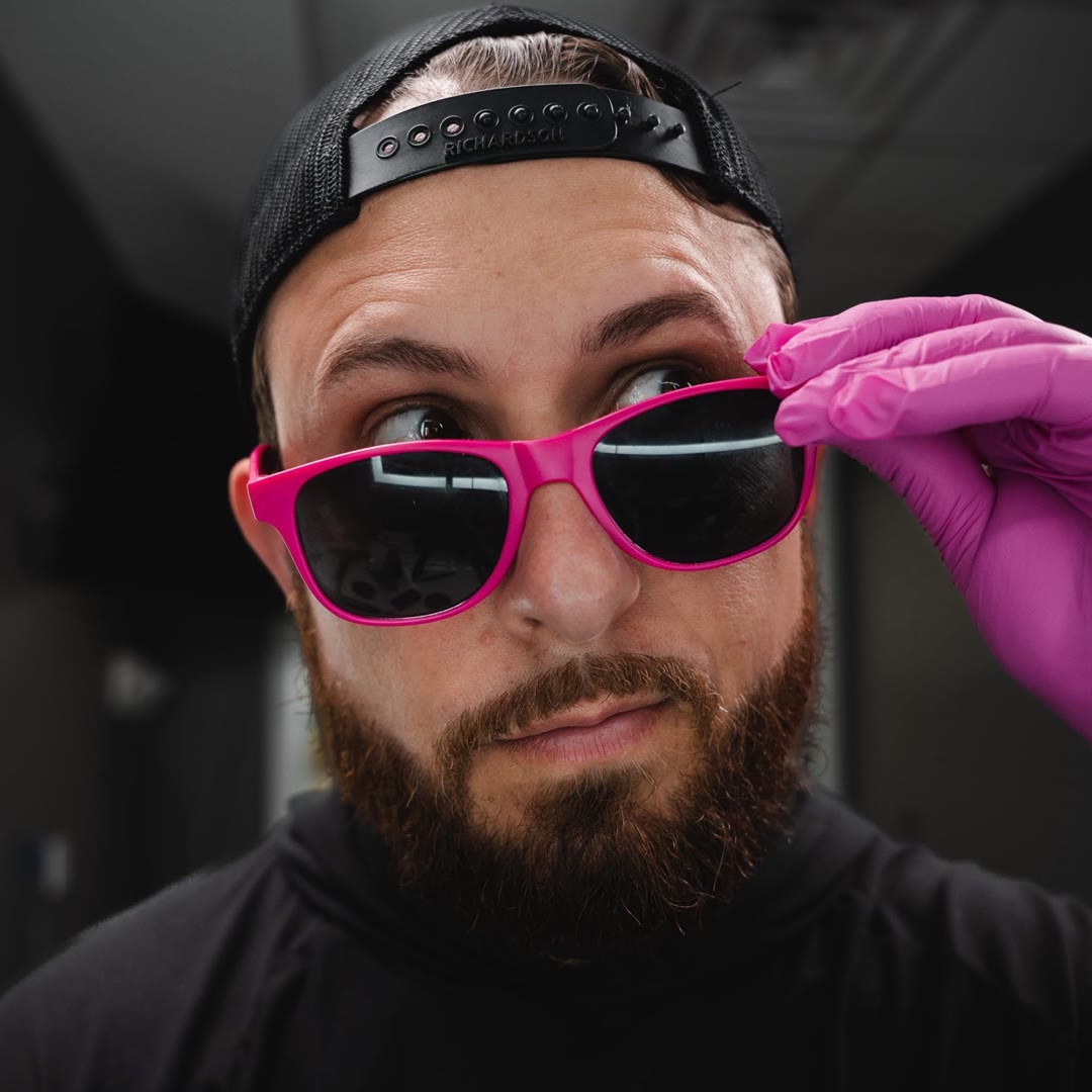 Justin — pink sunglasses, all personality